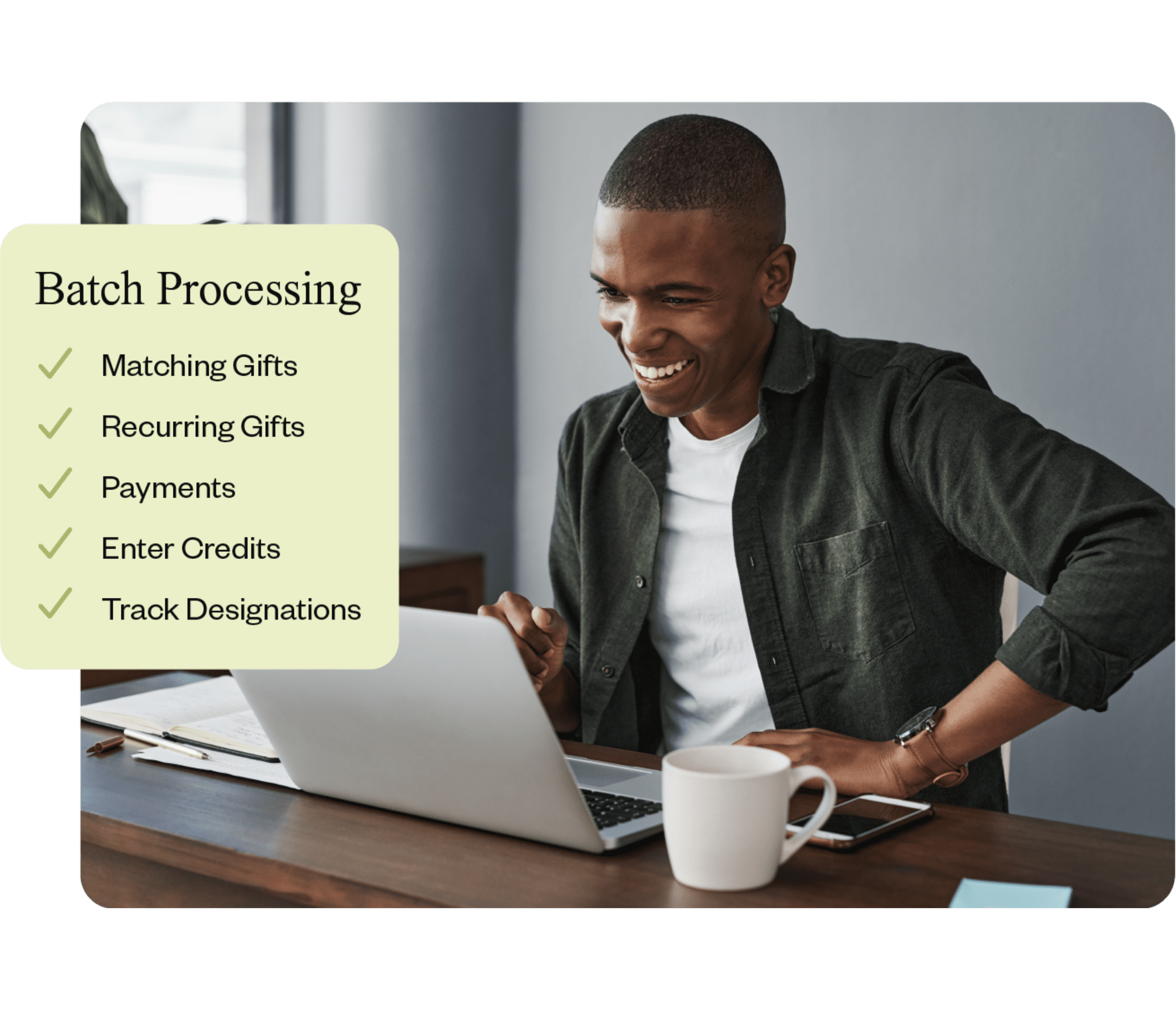 A fundraiser laughing while using his fundraising CRM to do batch processing.